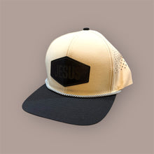 Load image into Gallery viewer, Beige and black cap with 'JESUS' patch on a beige background
